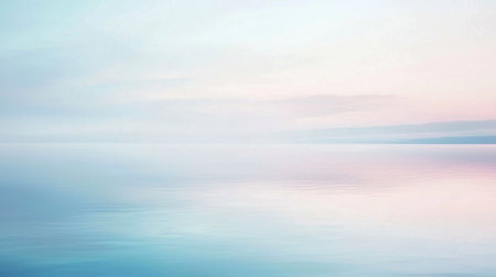 A stunning view of a soft-colored horizon over calm waters at dawn. This serene landscape captures tranquility, with gentle reflections and peaceful hues for relaxation.の素材