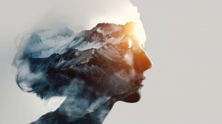 Artistic double exposure image showcasing a woman's silhouette intertwined with a breathtaking mountain landscape, symbolizing harmony and introspection.の素材