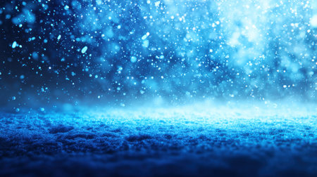 This captivating image illustrates gentle snowflakes falling in a dreamy blue winter atmosphere, creating a serene scene of soft white snow.の素材