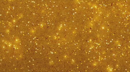 A vibrant and shimmering gold glitter background ideal for festive celebrations, art projects, and creative designs, capturing light and charm.の素材