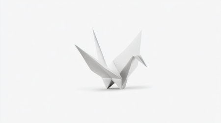 This image showcases an elegant white paper crane in a minimalistic style on a light background, embodying symbols of peace and hope. The delicate craftsmanship and graceful lines create a sense of tranquility in any design.の素材