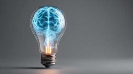 Captivating image of a glowing brain inside a light bulb, symbolizing creativity, intelligence, and the power of ideas. Perfect for topics on innovation.の素材