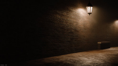 A serene scene featuring a warm light illuminating a textured brick wall in an empty urban alleyway at night, evoking mystery and tranquility.の素材