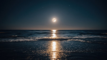 The breathtaking scene captures a full moon casting a soft glow over gentle ocean waves, creating a serene and peaceful atmosphere under a starry night sky.の素材