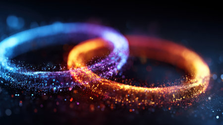Two dazzling rings of light intersect in a captivating display of colors and sparkles, perfect for adding a magical touch to designs.の素材