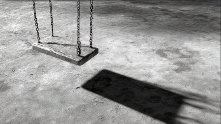 A serene black and white image featuring a wooden swing suspended from chains, casting a long shadow on an empty ground, evoking feelings of nostalgia and solitude.の素材