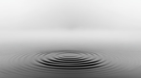 This image showcases a serene water ripple effect in black and white, creating a tranquil atmosphere. The soft gradient background enhances the peaceful vibe.の素材