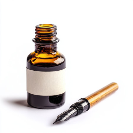 A vintage ink bottle paired with a fountain pen showcases elegance and creativity. Perfect for artistic projects, writing, and stylish stationery displays.の素材