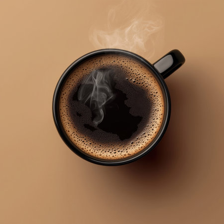 A close-up of steaming black coffee in a sleek black cup set against a soft, minimalist background, perfect for evoking comfort and warmth.の素材