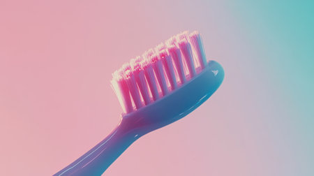 A colorful toothbrush stands out against a soft gradient background, symbolizing dental health and hygiene. Ideal for health-related visuals.の素材