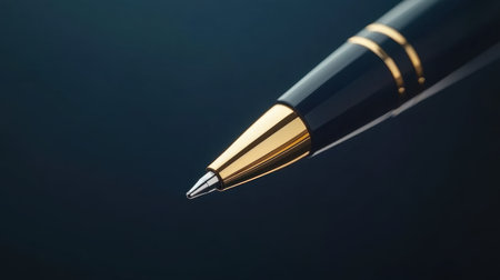 This stunning close-up image showcases a luxury ballpoint pen with a gold accent on a dark background, highlighting its elegant design and craftsmanship.の素材