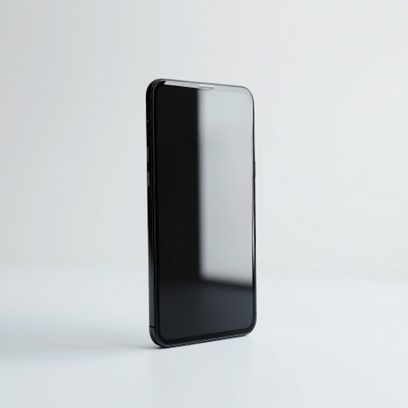 A sleek black smartphone stands upright on a minimalist white background. This image emphasizes modern design and technology, suitable for various purposes.の素材