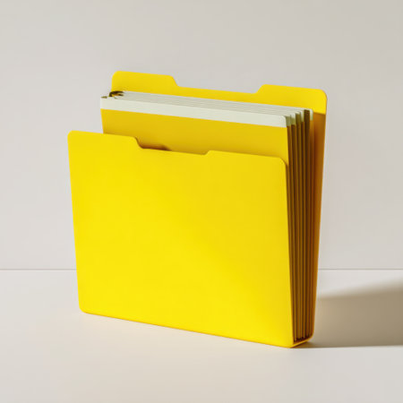 A bright yellow file folder with neatly organized documents sits against a clean, minimalist background. Ideal for office or school use.の素材
