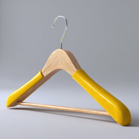 Showcase a vibrant yellow hanger crafted from wood, featuring a sleek minimalist design. Perfect for modern home decor, fashion presentations, and retail displays, this stylish accessory combines functionality with artistic appeal.の素材