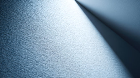 This image showcases a close-up of textured paper with subtle shadows and light reflections, ideal for backgrounds in art and design projects.の素材