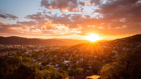 A stunning view of a cityscape at sunset, showcasing vibrant colors and a silhouette of mountains in the background. Perfect for nature lovers.の素材