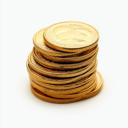 A close-up view of neatly stacked golden coins on a clean white background, symbolizing wealth, investment, and financial security.の素材