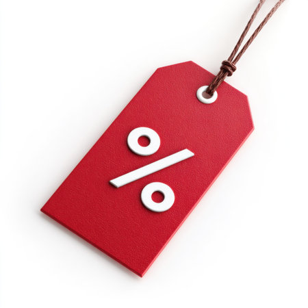 This image features a vibrant red discount tag prominently displaying a percentage sign, ideal for retail promotions and marketing materials.の素材