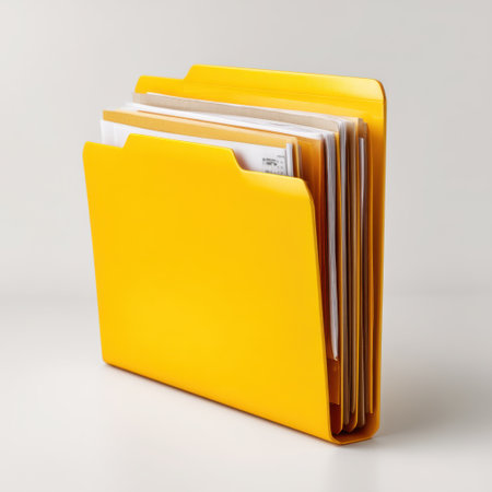 A bright yellow file folder filled with documents showcases organization in a modern office environment. Ideal for business use and workspace aesthetics.の素材