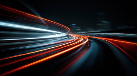 This striking image showcases vibrant light trails created by vehicles on a busy city road at night, emphasizing motion and energy.の素材