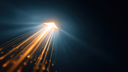 This striking image features an orange arrow that moves upwards, surrounded by radiant light streaks, symbolizing progress and vision.の素材