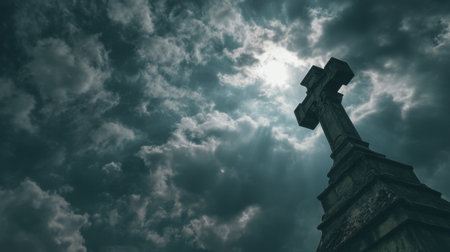 A powerful image of a cross silhouette set against a dramatic sky filled with dark clouds and shafts of light, evoking emotions of hope and contemplation.の素材