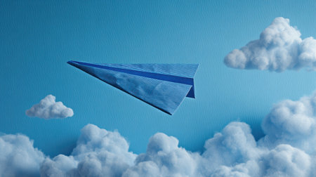 A serene blue paper airplane soars gracefully through fluffy clouds on a bright sky, symbolizing freedom and creativity in flight. Perfect for themes of imagination and exploration.の素材