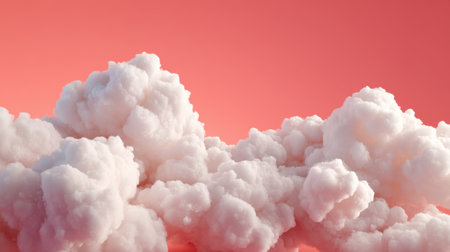 A stunning composition of fluffy pink clouds against a vibrant coral backdrop creates a dreamy atmosphere perfect for artistic visuals.の素材