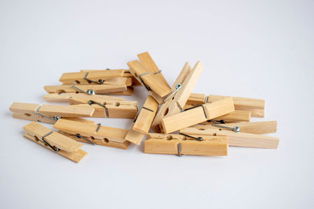 Wooden clothes peg, insulated on white background