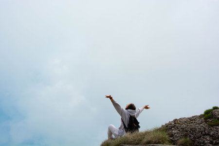 Girl enjoys a trip in the mountains, the concept of rest in the mountains.