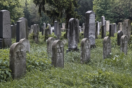 A set of jewish nameless graves with stones on the tombstones as the sign for having been visited recentlyの写真素材