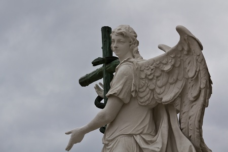 An angel with a serpent on its cross in front of Karlskirche in Viennaの写真素材