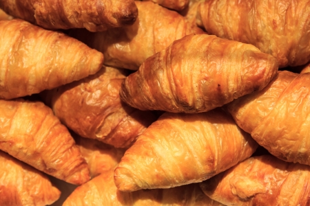 A group of croissants piled on anotherの写真素材