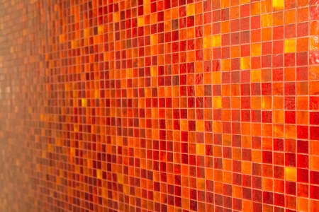An orange tile mosaic on a wallの写真素材