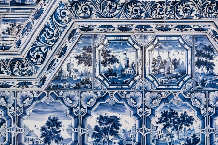 Detail of a tiled stove with blue and white paintingsの写真素材
