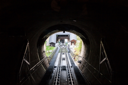 Exiting a tunnel downwards of the rack cog railway in Salzburg, Austria