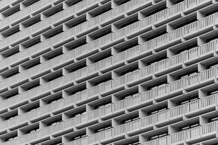 A symmetrical building facade with a repetitive pattern
