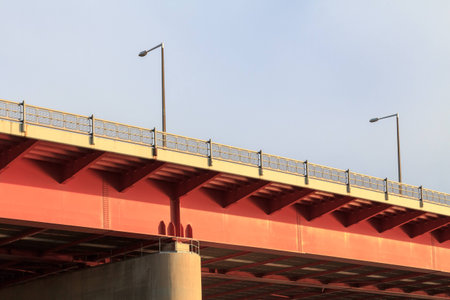 A strong steel car highway bridge at sunset in Viennaの写真素材
