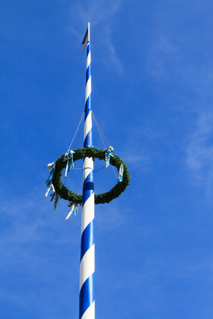 Top of a Bavarian Maypole on Viktualienmarkt, a famous delicatessen market, in Munich, Germanyの写真素材