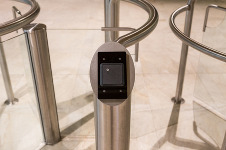 A card reader for security at an entrance with revolving doorsの写真素材