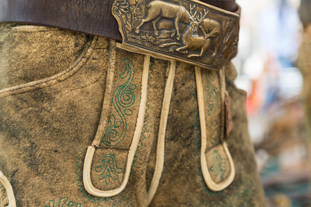 Classic green manual embroidery on traditional deerskin leather trousers from Salzkammergut, Austriaの写真素材