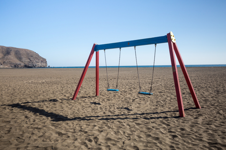 A swing with two seats on a beach in Fuerteventura, Spainの写真素材