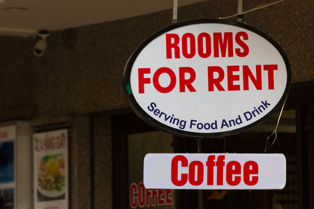 Sign for rooms for rent and serving food and drink on a building in Hanoi, Vietnamの写真素材