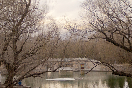 A Bridge Crossing Kunming Lake Outside The Summer Palace In Beijing Chinaの写真素材