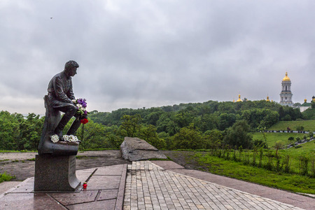 Monument to the military pilots (World War II) with a statue of famous soviet actor Leonid Bykov in Pechersk (Kiev, Ukraine).Kiev Pechersk Lavra is on the background.のeditorial素材