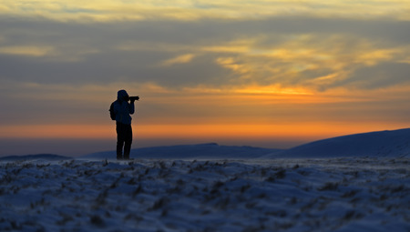 Hiking on mountain tops in winterの写真素材
