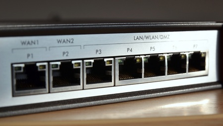 Network switch for connecting cables, close up on ports