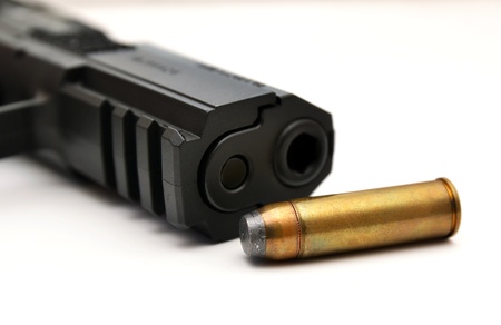 Detail of gun and ammunition, handgun and bulletの写真素材