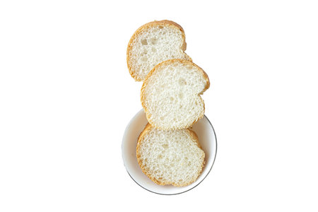 Sliced white bread in a bowl isolated on white background.の写真素材