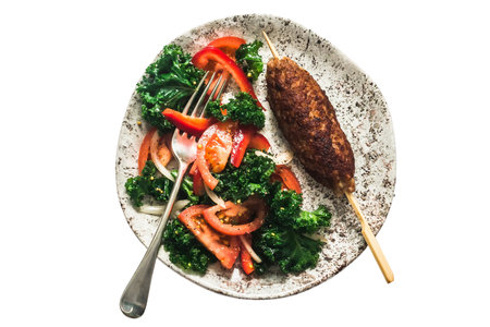 Kebab with kale, tomato and onion on a white backgroundの写真素材